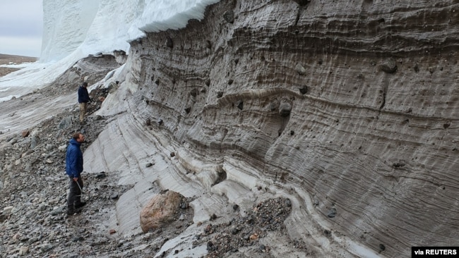 Scientists perform research field work at the edge of the Greenland Ice Sheet while studying the age of the 31-km-wide Hiawatha impact crater, buried under ice six-tenths of a mile (1 km) thick in 2019. (Shfaqat Abbas Khan/Handout via REUTERS)