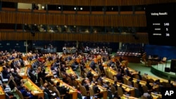 Screens display the results of a vote on a resolution regarding the war in Ukraine at U.N. headquarters, March 24, 2022.