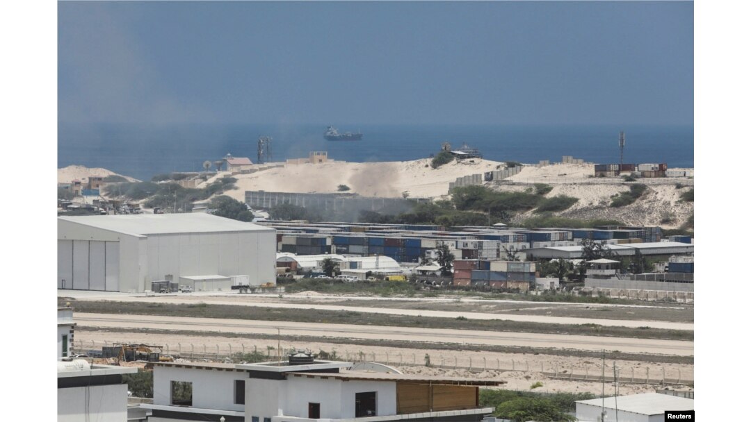 Smoke billows from shipping containers near the Adan Abdulle International Airport international in Mogadishu, Somalia, March 23, 2022.