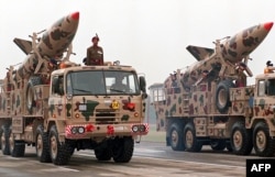 FILE - Two truck-mounted Indian surface-to-surface missiles form part of an annual army day parade in New Delhi, Jan. 15, 1999.