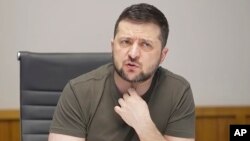 In this image from video provided by Ukraine's Presidential Press Office, Ukraine's President Volodymyr Zelenskyy speaks during an interview with independent Russian media from kyiv, Ukraine, on March 27, 2022.