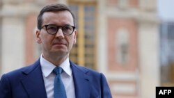 FILE - Poland's Prime Minister Mateusz Morawiecki arrives for the EU leaders summit at the Palace of Versailles, near Paris, March 11, 2022.