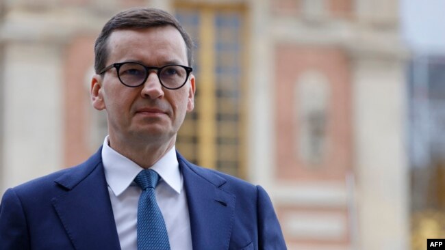 FILE - Poland's Prime Minister Mateusz Morawiecki arrives for the EU leaders summit at the Palace of Versailles, near Paris, March 11, 2022.