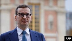 FILE - Poland Prime Minister Mateusz Morawiecki arrives for the EU leaders summit at the Palace of Versailles, near Paris, March 11, 2022.