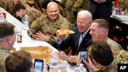 President Joe Biden visits with members of the 82nd Airborne Division at the G2A Arena, in Jasionka, Poland.