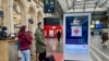 A sign at the Gare de l'Est in Paris directing Ukrainian refugees to a Red Cross center in the station that offers food and other assistance. (Lisa Bryant/VOA)