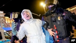 (File) Police detain a demonstrator during an action against Russia's attack on Ukraine in St. Petersburg, Russia. Russian police have made more than 15,000 arrests of anti-war protestors in cities across the country. 