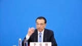 Chinese Premier Li Keqiang speaks during a press conference after the end of the closing session of China's National People's Congress (NPC) at the Great Hall of the People in Beijing, March 11, 2022. 