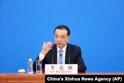 Perdana Menteri China Li Keqiang berbicara dalam konferensi pers setelah berakhirnya sesi penutupan Kongres Rakyat Nasional (NPC) China di Aula Besar Rakyat di Beijing, 11 Maret 2022. (Foto: via AP)