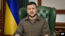 In this image from video provided by the Ukrainian Presidential Press Office, Ukrainian President Volodymyr Zelenskyy speaks from Kyiv, Ukraine, March 21, 2022.