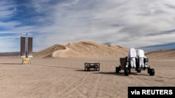 A handout image shows a prototype of California startup Astrolab 's Flex rover, that will be able to be operated directly by astronauts on the moon. The rover was tested in Death Valley National Park at the Dumont Dunes in December, 2021. (ASTROLAB/Handou