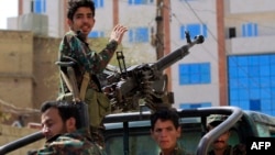 FILE - Forces loyal to Yemen's Houthi rebels take part in a military parade in the capital Sanaa, March 31, 2022.