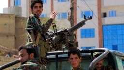 FILE - Forces loyal to Yemen's Houthi rebels take part in a military parade in the capital Sanaa, March 31, 2022.