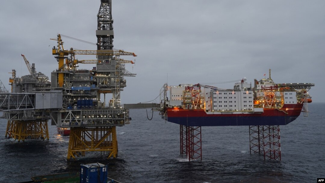 FILE - Platforms producing oil stand in the North Sea over the Johan Sverdrup oil field, 140 kilometers west of Stavanger, Norway, Dec. 3, 2019.