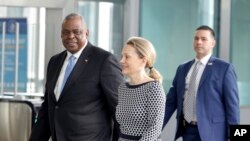 U.S. Secretary for Defense Lloyd J. Austin III, left, arrives for a meeting of NATO defense ministers at NATO headquarters in Brussels, Wednesday, March 16, 2022. NATO Secretary-General Jens Stoltenberg made it clear Tuesday that the 30-nation military alliance is set to radically change its security stance in Europe in response to Russia's war on Ukraine. (AP Photo/Olivier Matthys)