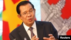 FILE - Cambodia's Prime Minister Hun Sen speaks with media during a news conference at the Government Office in Hanoi, Vietnam, Oct. 4, 2019. 