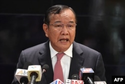 FILE - Cambodia's Foreign Minister Prak Sokhonn, the Association of Southeast Asian Nations (ASEAN) special envoy to Myanmar, speaks during a press conference at Phnom Penh international airport on March 23, 2022. (Photo by TANG CHHIN Sothy / AFP)