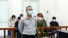 This picture taken and released by the Vietnam News Agency shows Vietnamese activist Le Van Dung in a courtroom during his trial in Hanoi, March 23, 2022, as he was sentenced to 5 year in jail. 