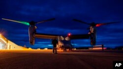 FILE - U.S. Marines inspect a MV-22B Osprey prior to flight at Norwegian Air Force Base Bodo during Exercise Cold Response 22, Norway, March 16, 2022. 