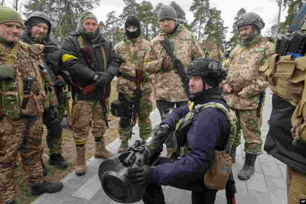 Ukrainian Territorial Defense Forces members train to use an NLAW anti-tank weapon on the outskirts of Kyiv, March 9, 2022.