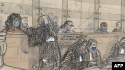 FILE - This photo taken Feb. 14, 2022, shows a sketch of Yassine Sebaihia, left, Farid Kheli, center, and Jean-Philippe Jean Louis, charged in connection with an attack in Saint-Etienne-du-Rouvray in 2016 that killed a priest, at the Palais de Justice courthouse in Paris.