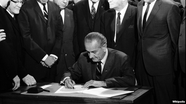 U.S. President Lyndon B. Johnson signs the Indian Civil Rights Act, Washington, D.C., April 11, 1968.