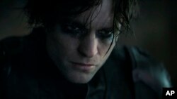 FILE - This image released by Warner Bros. Pictures shows Robert Pattinson without the mask in "The Batman."