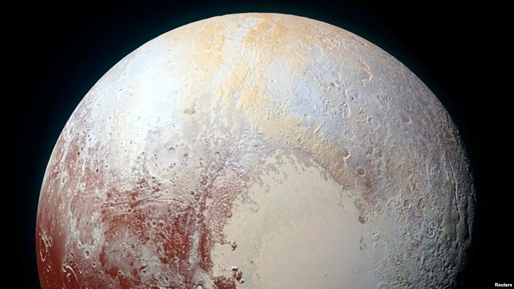 A heart shaped region named Sputnik Planum is seen in an enhanced view of Pluto in this undated image from NASA's New Horizons spacecraft, which flew past the dwarf planet in 2015. (REUTERS/NASA/JHUAPL/SwRI/Handout via Reuters)