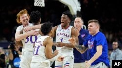 Kansas celebrates after their win against North Carolina in a college basketball game at the finals of the Men's Final Four NCAA tournament, Monday, April 4, 2022, in New Orleans. (AP Photo/Brynn Anderson)