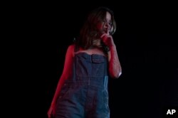 FILE - This image released by A24 shows Mia Goth in a scene from "X."