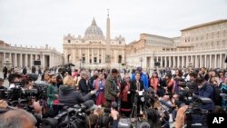 President of the Metis community, Cassidy Caron, center, speaks to the media in St. Peter's Square after their meeting with Pope Francis at The Vatican, March 28, 2022.