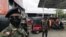 Sri Lanka's Army members stand guard at a Ceylon Petroleum Corporation fuel station to help stations distribute oil during the fuel crisis, in Colombo, Sri Lanka, March 22, 2022. 