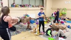 Refugee Children Find Moment of Joy in Play Fight With Soft Toys 