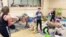 Refugee Children Find Moment of Joy in Play Fight With Soft Toys 