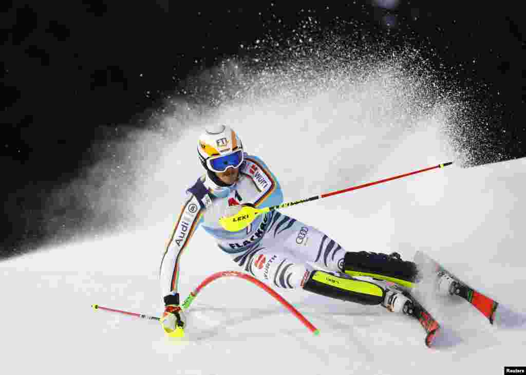 Skier Linus Strasser of Germany speeds down a mountain in the men&#39;s night slalom race during the FIS Alpine Ski World Cup in Flachau, Austria. ( REUTERS/Lisa Leutner )