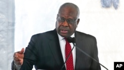 FILE - Associate Justice Clarence Thomas of the U.S. Supreme Court delivers a keynote speech during a dedication of the Nathan Deal Judicial Center in Atlanta, Feb. 11, 2020. 