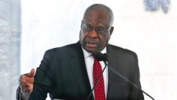 FILE - Associate Justice Clarence Thomas of the U.S. Supreme Court delivers a keynote speech during a dedication of the Nathan Deal Judicial Center in Atlanta, Feb. 11, 2020. 