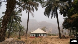 FILE: view of a house that was a clinic and is now a shelter for security officials protecting Manga village, bordering Nigeria and Cameroon, on January 28, 2022 weeks after suspected separatist fighters allegedly attacked Manga, which left five people dead and 21 missing.