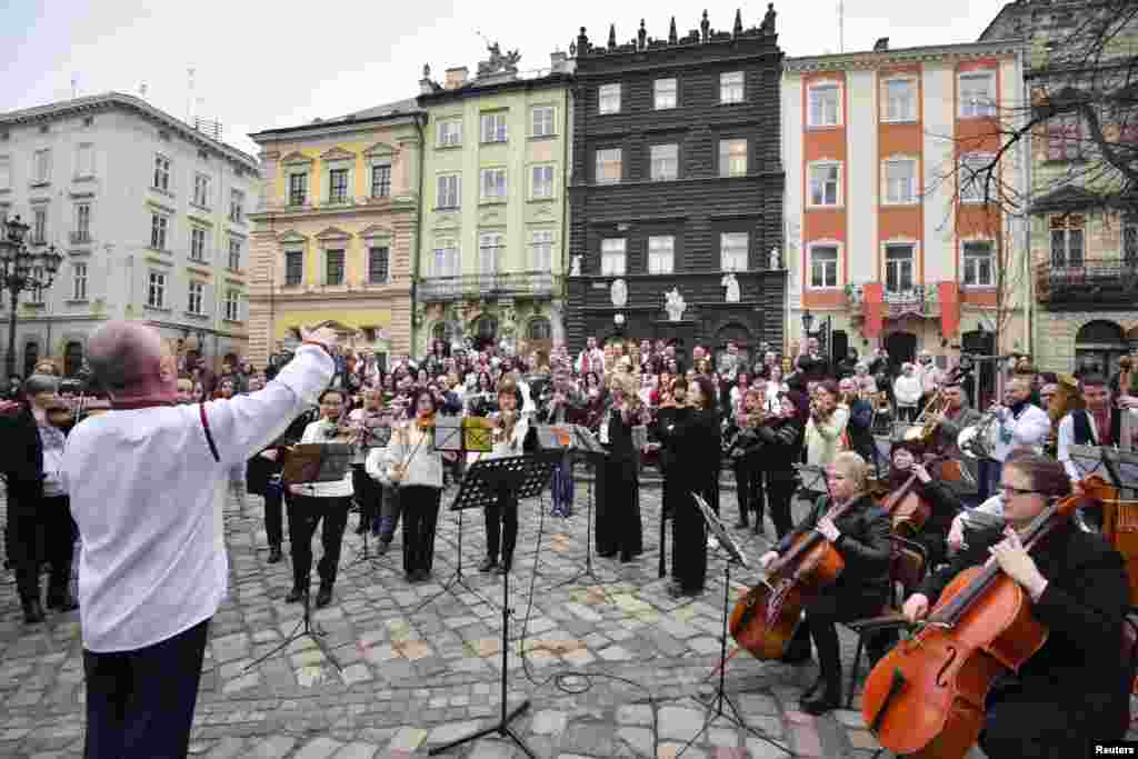 Members of the Lviv symphony orchestra play an outside concert for a &quot;free sky&quot; and against the ongoing Russian invasion of Ukraine, in downtown Lviv, Ukraine.