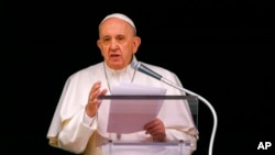 FILE - In this June 6, 2021, photo, Pope Francis speaks from the window of his studio overlooking St. Peter's Square at the Vatican.