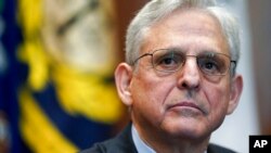 FILE - US Attorney General Merrick Garland listens during a meeting of the COVID-19 Fraud Enforcement Task Force at the Justice Department, March 10, 2022, in Washington. 