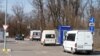 A convoy of volunteers carrying supplies for civilians stuck in Mariupol leaves Zaporizhzhya on March 29, 2022, amid Russian invasion of Ukraine.