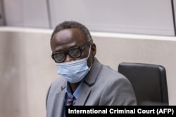 This handout photo obtained from ICC via ANP on April 4, 2022, shows former senior commander of the Sudanese Janjaweed militia Ali Muhammad Ali Abd-Al-Rahman during a confirmation hearing at the Hague.