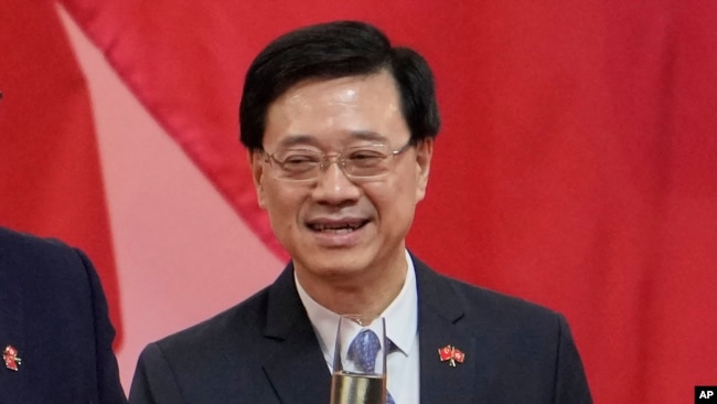 Hong Kong's Chief Secretary John Lee attends a reception, following the flag-raising ceremony for the celebration of 24th anniversary of Hong Kong handover to China, in Hong Kong, Thursday, July 1, 2021. (AP Photo/Kin Cheung)