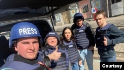 Ukrainian fixer Oleksiy Muzhchyna, right, stands with a crew from the Qatari-funded Al Jazeera TV news network in the Ukrainian city of Kharkiv, March 31, 2022. (Courtesy: Oleksiy Muzhchyna)
