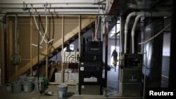 FILE - View of a gray water system that will capture shower water and reuse it to flush toilets and thereby cutting household water usage by 25% in Castle Rock, Colorado, Dec. 15, 2021.