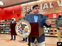 FILE - Gov. J.B. Pritzker defends his plan to offer election-year tax relief to consumers on groceries, gasoline and property in this Feb. 8, 2022 photo.