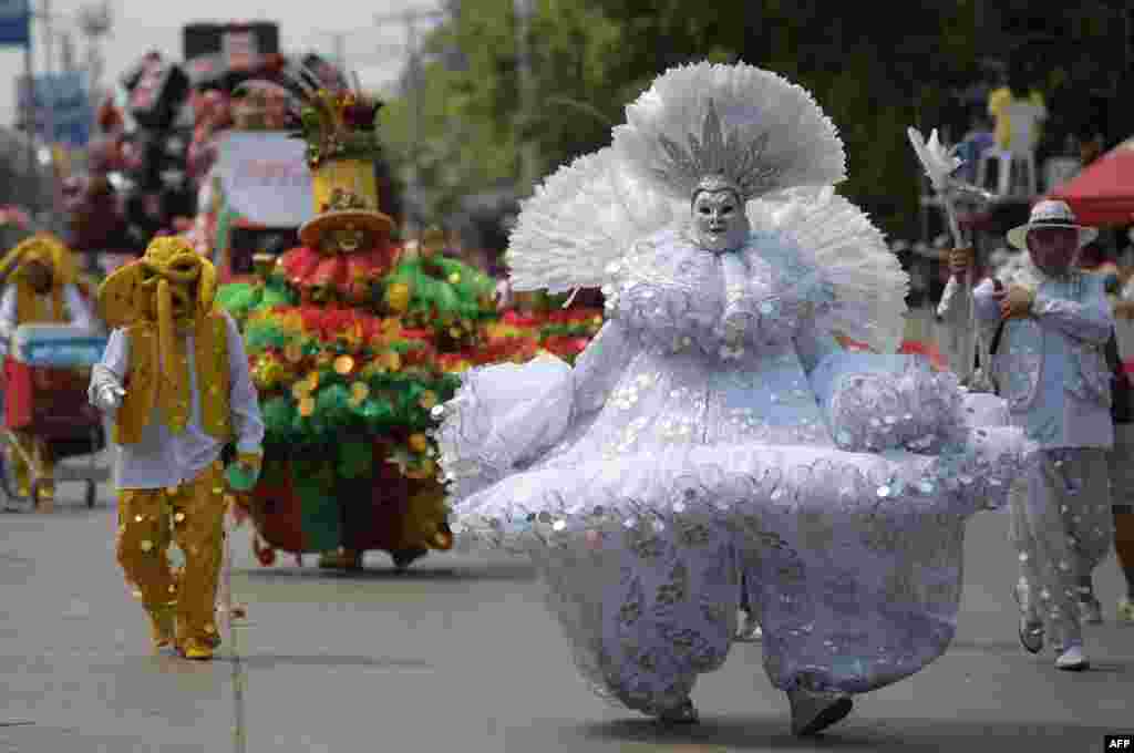 Revelers perform in the Battle of Flowers parade as part of Barranquilla&#39;s Carnival, Colombia, March 26, 2022.