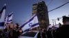 Israelis protest a wave of deadly attacks at a main junction in Tel Aviv, Israel, March 30, 2022. 