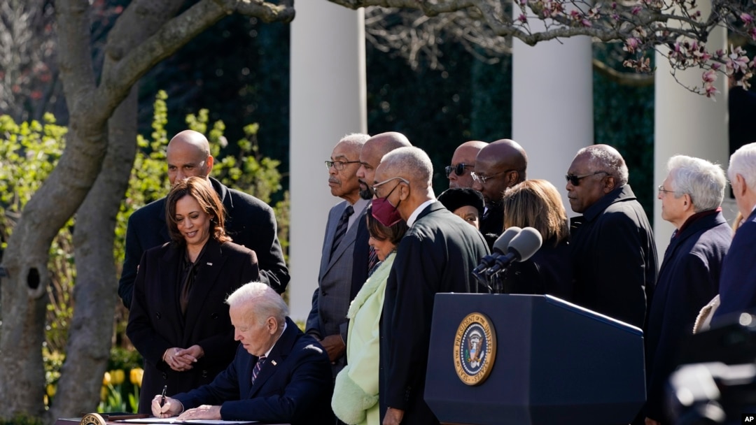 President Joe Biden signs the Emmett Till Anti-Lynching Act in the Rose Garden of the White House, March 29, 2022, in Washington. 